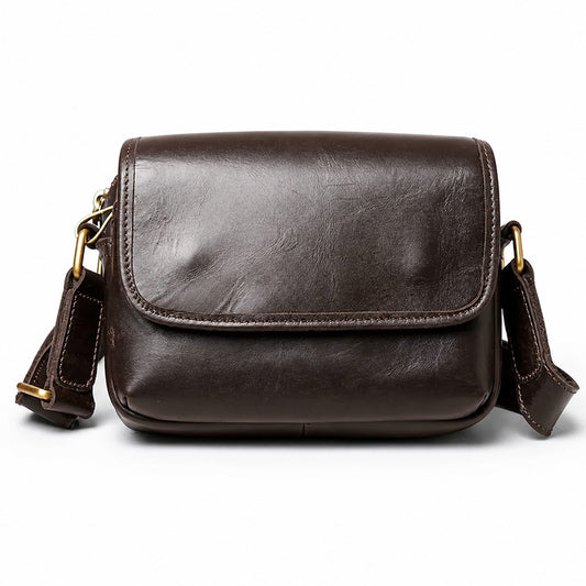 Brown leather small crossbody bag white background front view