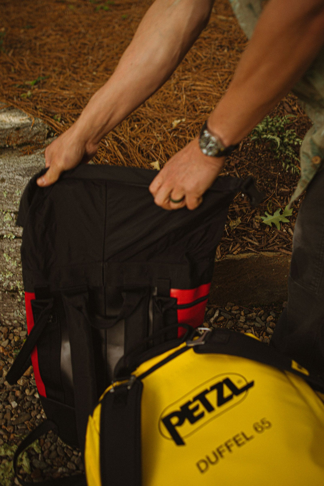 Backpack and duffel bag staged together for one-bag travel packing