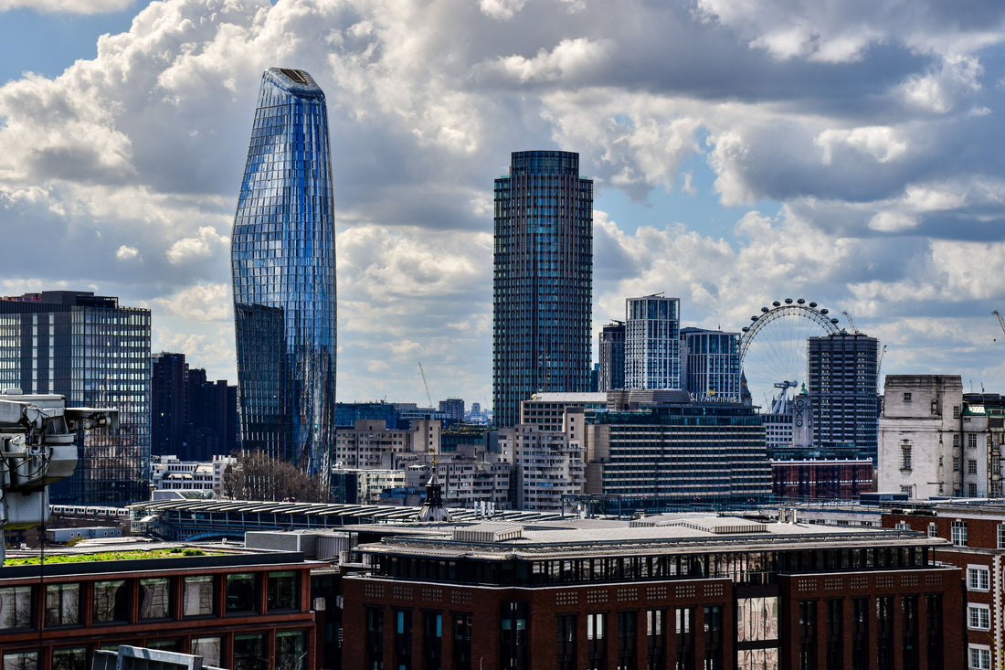 Modern skyline of London with skyscrapers and London Eye on a cloudy day