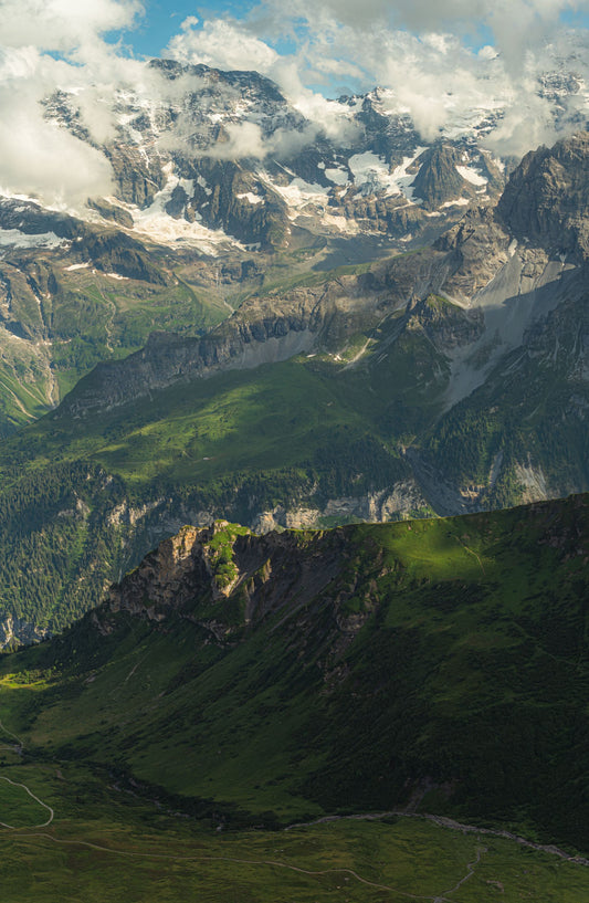 Stunning Alpine landscape in Lauterbrunnen, Switzerland with green meadows and rugged peaks