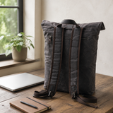 Vintage Roll Top Waxed Canvas Backpack Rucksack exact product scene front lifestyle