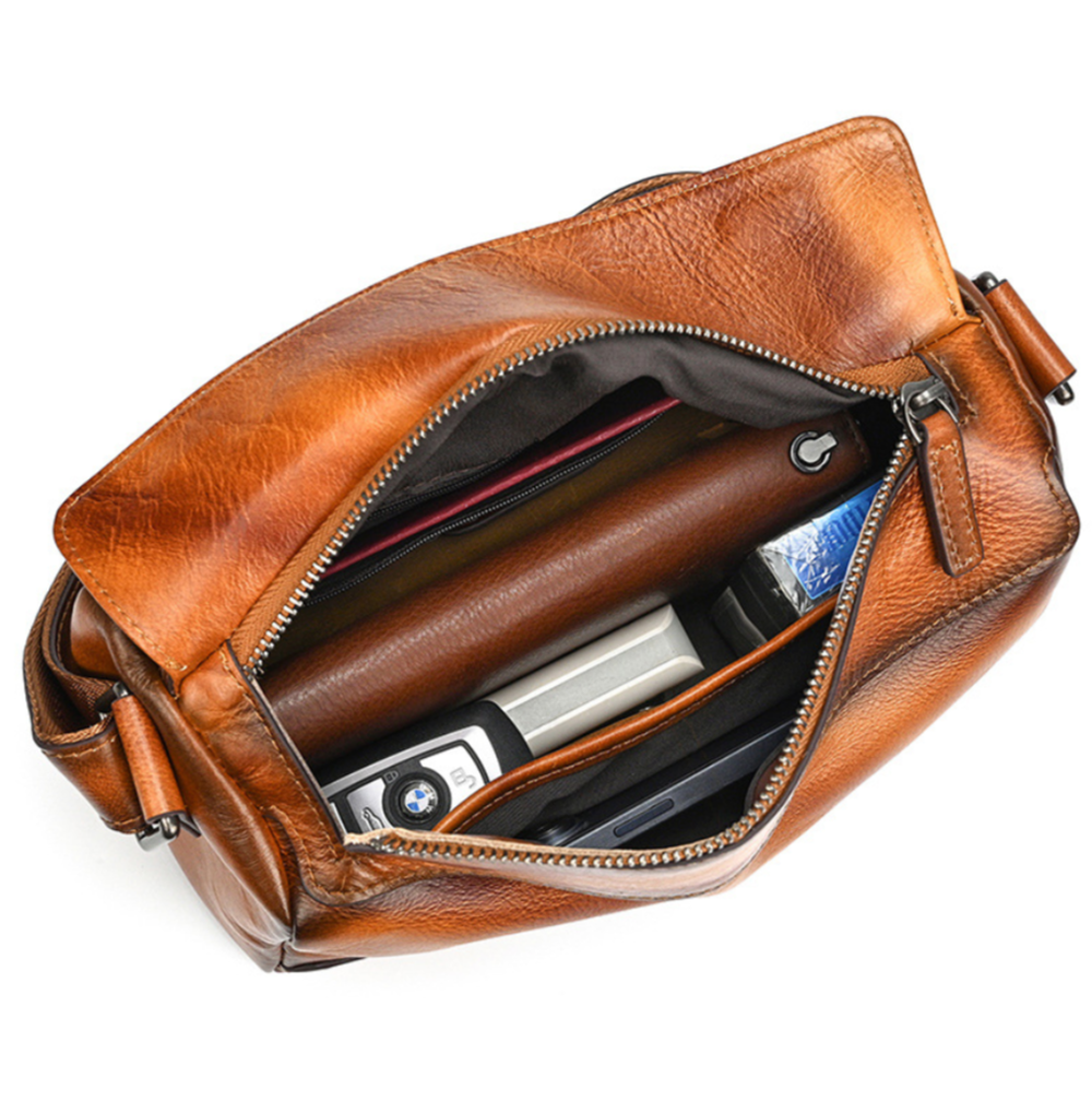 Woosir vintage leather crossbody bag open interior with essentials