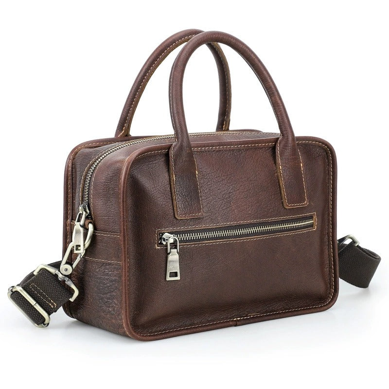 Full-grain leather compact crossbody handbag on white background