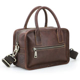 Full-grain leather compact crossbody handbag on white background