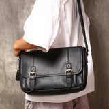Black leather messenger bag front view