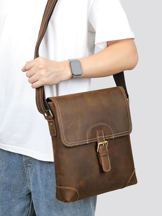 Vintage leather messenger bag worn front view