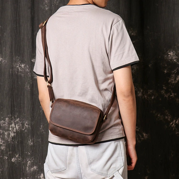 Leather crossbody bag front buckle detail