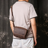 Leather crossbody bag front buckle detail