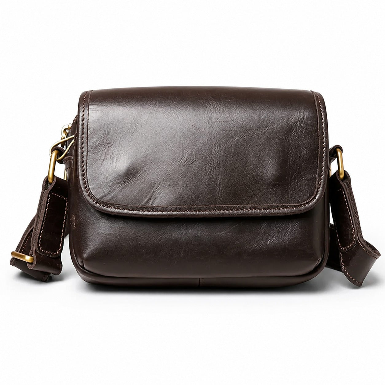 Brown leather small crossbody bag white background front view