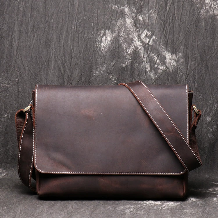 Adjustable strap leather messenger bag detail