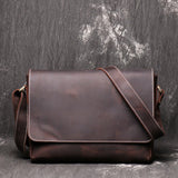 Adjustable strap leather messenger bag detail